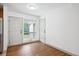 Entryway featuring hardwood floors, white walls, and natural light from the window at 1420 S Leyden St, Denver, CO 80224