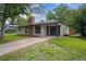 Single story home with brick chimney and attached garage at 1420 S Leyden St, Denver, CO 80224