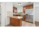 Kitchen featuring stainless steel appliances, stone countertops, and tile flooring at 1420 S Leyden St, Denver, CO 80224