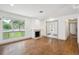 Hardwood floors, fireplace, and large picture window in a well lit living room at 1420 S Leyden St, Denver, CO 80224