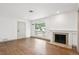 Living room with hardwood floors, fireplace, and lots of light at 1420 S Leyden St, Denver, CO 80224