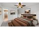 Spacious bedroom showcasing neutral decor, with a ceiling fan and ample natural light at 420 Dudley St, Lakewood, CO 80226