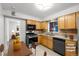 Functional kitchen with appliances and wooden cabinets at 420 Dudley St, Lakewood, CO 80226