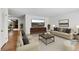A modern living room with neutral-toned furniture and decor, creating a comfortable space at 420 Dudley St, Lakewood, CO 80226