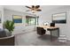 Home office area with a modern desk setup and large window for natural light at 420 Dudley St, Lakewood, CO 80226