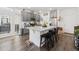 Modern kitchen with gray cabinets, granite countertops, and a spacious island with seating at 20000 E 40Th Ave # 4, Denver, CO 80249
