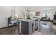 Modern kitchen with a center island, flowing into a cozy living space with lots of natural light at 20000 E 40Th Ave # 4, Denver, CO 80249