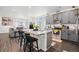 Open kitchen featuring stainless steel appliances and a large island perfect for entertaining at 20000 E 40Th Ave # 4, Denver, CO 80249
