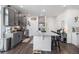 Modern kitchen boasts stainless steel appliances, gray cabinets, and granite countertops at 20000 E 40Th Ave # 4, Denver, CO 80249