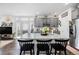 Bright eat-in kitchen featuring an island with granite countertops and gray cabinets at 20000 E 40Th Ave # 4, Denver, CO 80249
