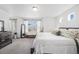Sunlit main bedroom showcases modern furnishings and a tranquil atmosphere at 20000 E 40Th Ave # 4, Denver, CO 80249