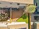 Birds eye view of a backyard including a composite deck, a small lawn, and stone pavers at 4535 W 50Th Ave, Denver, CO 80212