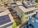Aerial view of backyard featuring a patio and landscaped yard, with solar panels on the roof at 4535 W 50Th Ave, Denver, CO 80212