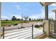 Balcony with metal railings providing views of a field and street at 4535 W 50Th Ave, Denver, CO 80212