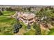 Exterior view of the golf course clubhouse, beautifully landscaped with a serene setting at 4535 W 50Th Ave, Denver, CO 80212
