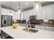Spacious kitchen with white countertops, white cabinets, and stainless steel appliances at 4535 W 50Th Ave, Denver, CO 80212
