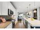 Open-concept kitchen featuring a large island, stainless steel appliances, and hardwood floors at 4535 W 50Th Ave, Denver, CO 80212
