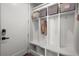 Mudroom area with built-in shelving, storage cubbies, and coat hooks for organization at 4535 W 50Th Ave, Denver, CO 80212