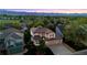 Charming two-story home featuring a well-manicured lawn, lovely landscaping, and mountain views at 9948 Silver Maple Rd, Highlands Ranch, CO 80129