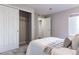 Bedroom with sliding door closet and soft gray walls at 4538 Copeland Loop # 202, Highlands Ranch, CO 80126