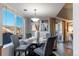 Bright dining area with a glass-top table and four grey chairs at 4538 Copeland Loop # 202, Highlands Ranch, CO 80126