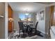 Dining area with a round table, four chairs, and a cowhide rug at 4538 Copeland Loop # 202, Highlands Ranch, CO 80126