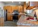 Modern kitchen featuring stainless steel appliances and granite countertops at 4538 Copeland Loop # 202, Highlands Ranch, CO 80126