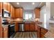 Well-equipped kitchen featuring stainless steel appliances and wood cabinetry at 4538 Copeland Loop # 202, Highlands Ranch, CO 80126