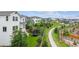 Lush backyard features a trampoline and view of the community playground at 6679 Kenzie Cir, Castle Pines, CO 80108