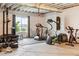 Basement gym with machines, weights, and punching bag at 6679 Kenzie Cir, Castle Pines, CO 80108
