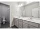 Bathroom features a double sink vanity and a separate toilet room, maximizing convenience and privacy at 6679 Kenzie Cir, Castle Pines, CO 80108