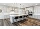 Modern kitchen with a large center island, stainless steel appliances, and sleek cabinetry at 6679 Kenzie Cir, Castle Pines, CO 80108