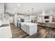Spacious kitchen with stainless appliances, central island, and open floor plan at 6679 Kenzie Cir, Castle Pines, CO 80108