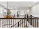Upstairs loft featuring a view of the floor below and access to various rooms at 6679 Kenzie Cir, Castle Pines, CO 80108