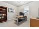 Study room with a modern desk setup and bookshelf, perfect for a home office at 6679 Kenzie Cir, Castle Pines, CO 80108