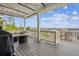 Spacious outdoor deck with a cozy seating area and scenic views of the neighborhood at 6679 Kenzie Cir, Castle Pines, CO 80108