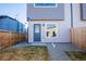 Cozy backyard space with modern siding, a door, a window, and partial fencing offering privacy and outdoor enjoyment at 4341 N Columbine St, Denver, CO 80216