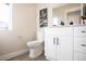 Elegant half bathroom features a white vanity with a light countertop and black fixtures at 4341 N Columbine St, Denver, CO 80216