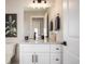 Elegant half bathroom features a white vanity with a light countertop and modern fixtures at 4341 N Columbine St, Denver, CO 80216