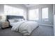 Inviting bedroom featuring a plush bed, soft carpet, and plenty of natural light at 4341 N Columbine St, Denver, CO 80216