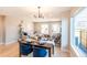 Open concept dining area adjacent to the living room and kitchen at 4341 N Columbine St, Denver, CO 80216