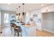 Modern kitchen with white cabinets, quartz countertops, and island at 4341 N Columbine St, Denver, CO 80216