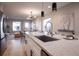 Modern kitchen with a large quartz island, stainless steel appliances, and an open floor plan at 4341 N Columbine St, Denver, CO 80216