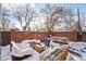 Cozy backyard patio with fire pit and seating area, perfect for winter nights at 1433 E 7Th Ave, Denver, CO 80218