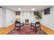 Finished basement with hardwood floors, a fireplace, and comfortable seating at 1433 E 7Th Ave, Denver, CO 80218