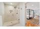 Modern bathroom with a large walk-in shower and marble tile at 1433 E 7Th Ave, Denver, CO 80218