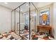 Luxury bathroom with a soaking tub and geometric tile floor at 1433 E 7Th Ave, Denver, CO 80218