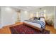 Large bedroom with a king-size bed and stylish rug at 1433 E 7Th Ave, Denver, CO 80218