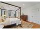 Bright bedroom with a four-poster bed and ample natural light at 1433 E 7Th Ave, Denver, CO 80218