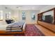 Spacious bedroom with a king-size bed and built-in shelving at 1433 E 7Th Ave, Denver, CO 80218